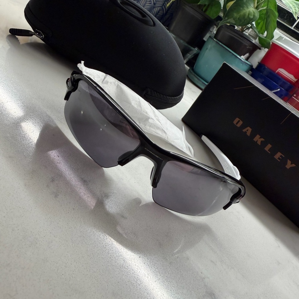 Oakley Black Frame Sunglasses with Gray Lenses
